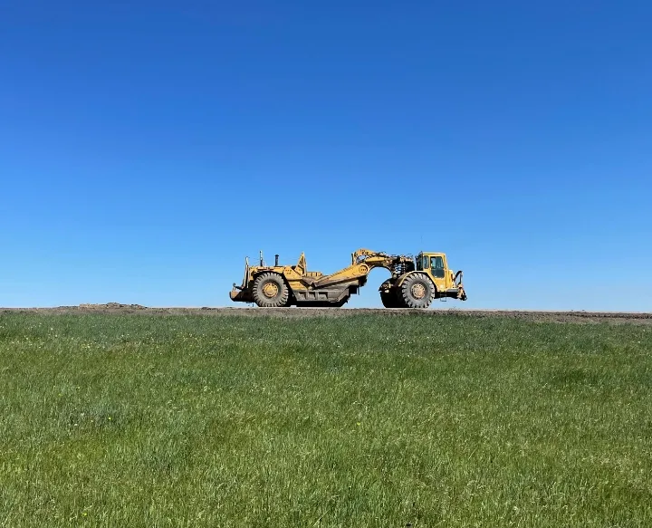 Earth moving equipment on hill